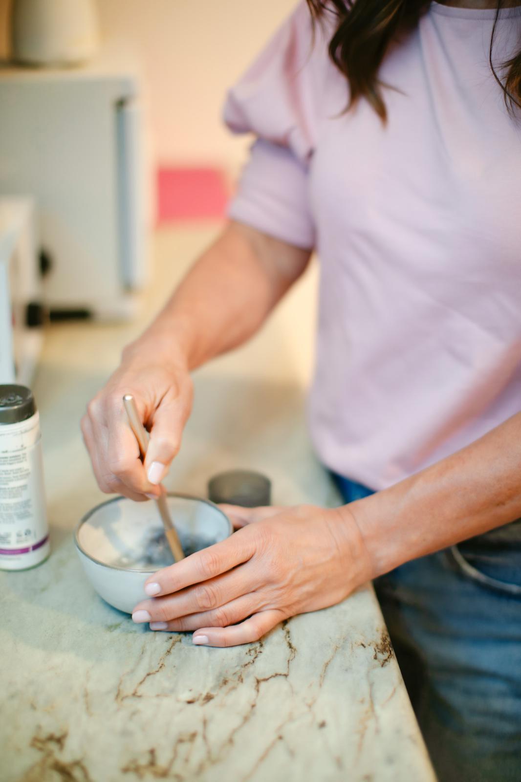 Esthetician mixing a facial mask